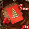 Elegant 3D Christmas card featuring a red background and gold foil Merry Christmas text - Christmas Tree Style