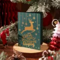 Tarjeta de Navidad vintage verde oscuro con reno en pan de oro y saludo festivo - Estilo Ciervo de Navidad / Verde