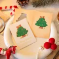 Elegant hollow Christmas tree greeting card set with warm festive message on white plate. - Christmas Tree / 10 Sheets Set