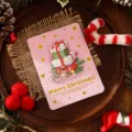 Creative pink 3D Christmas card with gold foil hearts and festive gift box illustration - Christmas Gift Style