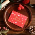 Festive red Christmas greeting card with elegant gold foil 'Merry Christmas' text and icons - Heart Style