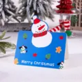 Retro blue Christmas greeting card featuring a cute snowman and dog illustrations - Snowman