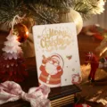 White Christmas greeting card with gold foil Merry Christmas and Santa Claus design - Santa Claus