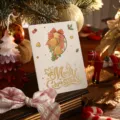 Festive Christmas card featuring gold foil Merry Christmas text and cutout bell design - Christmas Bell
