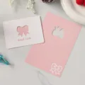Tarjetas de felicitación minimalistas rosas y blancas con lazos y mensaje "Good Luck" - Estilo Lazo / Juego de 10 hojas