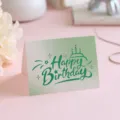 Elegant Happy Birthday greeting card featuring a green gradient and artistic hand-lettering - Style 7