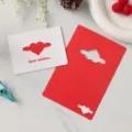 Set di biglietti d'auguri rossi e bianchi con cuori alati e la scritta Best Wishes - Stile Cuore Ali / Set di 10 fogli