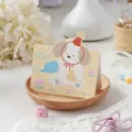 Opvouwbare wenskaart met schattige puppy en bloemen voor verjaardagen of Nieuwjaar voor kids - Hond