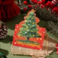 Festive gold-stamped Christmas tree greeting card with Merry Christmas message on red card - Christmas Tree Style 10