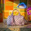 Detailed view of a trendy purple and white checkered duffle bag for travel and organization - Light Purple