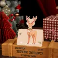 Vintage-style Christmas greeting card featuring a cute reindeer and hanging hole - Christmas Reindeer Blue
