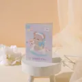 Exquisite cute purple cartoon animal birthday greeting card featuring a bear illustration - Rocking Horse Bear