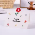Creativa tarjeta de felicitación de dibujos animados con flor roja pop-up y texto - Flor Pequeña