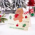 Retro Christmas gift card featuring a cute bear holding an apple with a green grid pattern - Bear with Apple