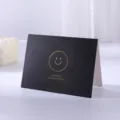 Elegant black greeting card with gold foil smiley face and Thank You for Everything - Smiley Face / Black