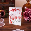 Detail of vintage greeting card with hand-drawn red roses and romantic English text - Love You Forever (1251)