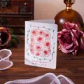 Detailed view of a vintage folding greeting card with elegant red rose illustrations. - Grow Old Together (1251)