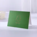 Dark green greeting card with gold-stamped Christmas tree and MEET SLOWLY quote - Tree / Dark Green