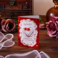 Romantic vintage red rose greeting card on wooden table with pearls and roses. - Give You My World (1251)
