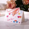 Carte de vœux avec illustration d'avion en papier et message Sweet Dream dessiné - Style Avion en Papier