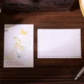 Floral lily of the valley postcard with inspirational quote on dark wood background - Moon Flower Style