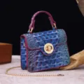 Detailed macro view of the blue gradient crocodile texture on a vintage retro handbag - Purple & Blue