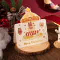 Festive gold-foiled Christmas card with carousel design on rustic wooden slice base - Merry-go-round (464)