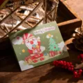 Festive tri-fold Christmas greeting card featuring a cute cartoon Santa Claus design. - Merry Christmas Style