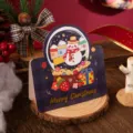 Festive Christmas greeting card featuring a gold foil snowman design on a rustic wooden base - Christmas Snowman (464)