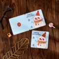Adorable square cartoon snowman Christmas folding greeting card on dark wood background - Christmas Snowman Style / 10 Sheets Set