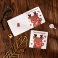 Square folding Christmas card with cute cartoon reindeer design on wooden background - Reindeer Style / 10 Sheets Set