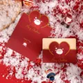 Creative heart-shaped Christmas greeting card with gold foil Santa Claus and snow scene - Santa Claus Style