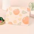 Cute peach-colored greeting card featuring orange fruit patterns and gold lettering - Orange