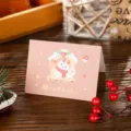 Close-up of pink Christmas card with gold foil Merry Christmas text and cute snowman illustration - Snowman / 10 Sheets Set