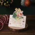 Folded Christmas greeting card with gold stamped Merry Christmas and snowman design - Snowman