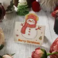 Vintage Weihnachtsgeschenkkarte mit süßem Schneemann und Merry Christmas Schriftzug - Weihnachtskollektion - Schneemann & Winter