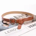 Brown leather belt for women featuring a stylish silver heart-shaped chain buckle - Camel