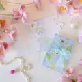 Detailed view of floral greeting card featuring blue organza ribbon and 'Thank You' gold script - Romantic Blue-Purple Floral Style