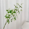 Elegant white artificial rice grain flower spray with green leaves for home decor - White