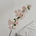Artificial pink cherry blossom branch for home decor and elegant flower arrangements. - Light Pink