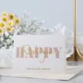 Elegante tarjeta de felicitación dorada con texto rosa Happy Wish You para ocasiones especiales - Feliz Cada Día