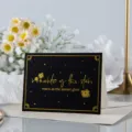 Elegante tarjeta de felicitación negra con dorado y motivos florales románticos - Warm Like Sunset Bright Like Starlight