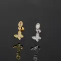 Detailed macro shot of elegant gold and silver butterfly zircon cartilage earrings - Butterfly Style (CC167)