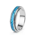 Polished silver titanium steel spinner ring featuring a vibrant blue opal inlay band design. - Size 6 / Steel
