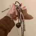 Portachiavi mini stivale da neve marrone grazioso ciondolo a stella accessorio borsa chic. - Ciondoli per stivali da neve