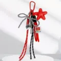 Portachiavi borsa rosso e nero con fiocco di perle e ciondolo stella accessorio carino - Rosso