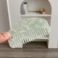 Close-up of small acetate hair comb with heart cutouts in mint green marble - Heart Cutout Half Moon Comb / Small (8.8x4.8cm) / Light Green