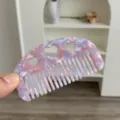 Macro detail view of a small heart-cutout acetate hair comb with pink and purple marble texture - Heart Cutout Half Moon Comb / Small (8.8x4.8cm) / Purple Pink
