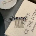 Close-up view of a cute leopard print dog acetate hair comb with shiny metal prongs - Gray Blue Leopard