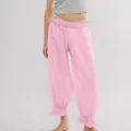 Pink corduroy casual trousers for women featuring elastic waist and stylish ruffled hem details. - S / Bottoms / Pink